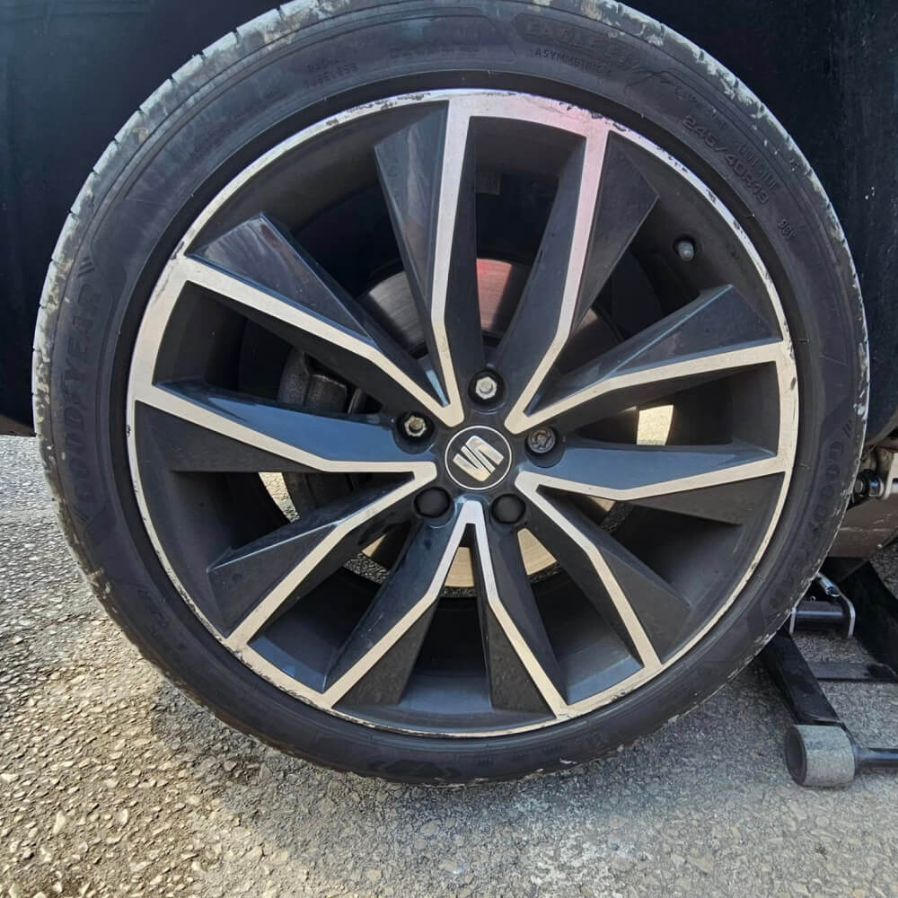 Alloy wheel with kerb damage before repair - Example 2